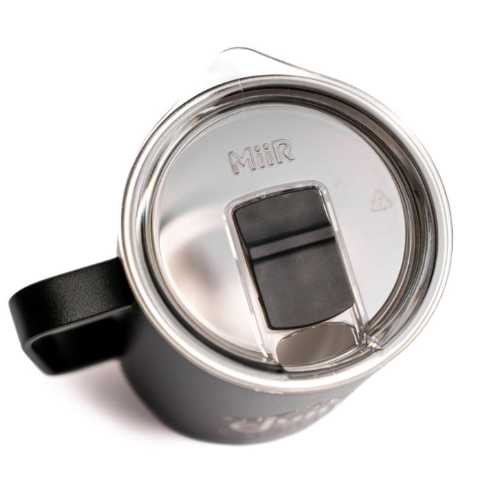 Black Metal Coffee mug with the julbo logo and coordinates of the Julbo HQ in France #color_julbo-camper-mug-12oz-black-mont-blanc