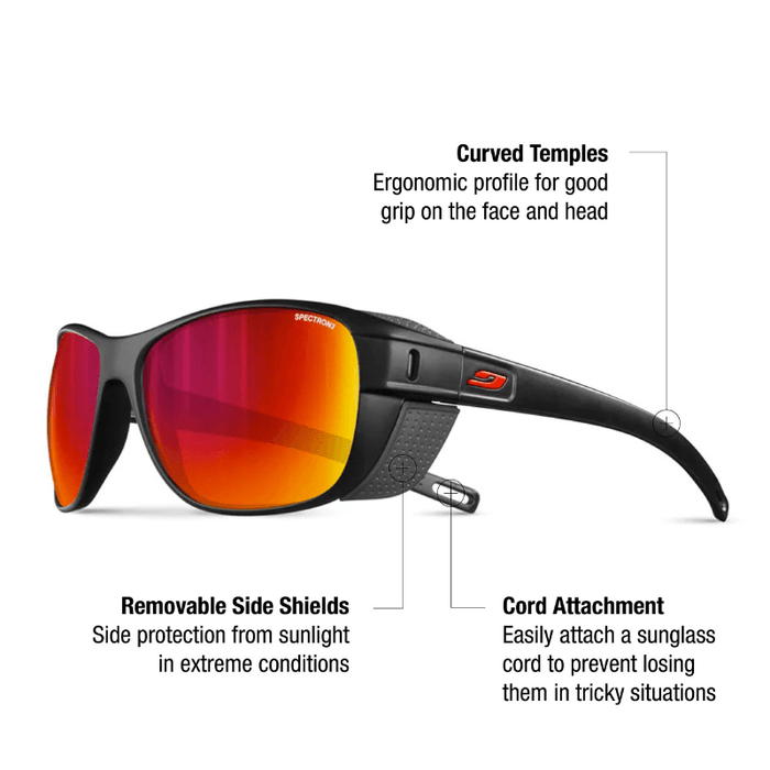 The Julbo-usa Camino sunglasses feature black frames with red reflective lenses, curved temples, removable side shields for trekking sun protection, and an attachment point for a sunglass cord. #color_black-with-spectron-3-lens