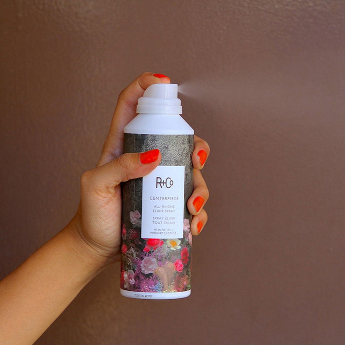 Lifestyle image of R+Co Centerpiece All-in-One Elixir Spray