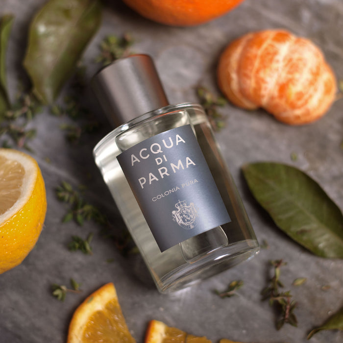 Lifestyle image of Acqua di Parma Colonia Pura Eau de Cologne variant: 1.7 oz (Gray Bottle)