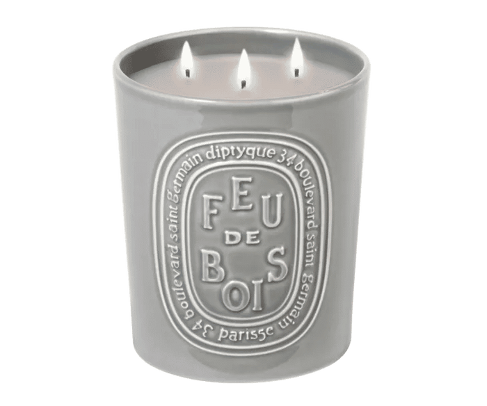 Image of an open Diptyque Feu de Bois (Wood Fire) Candle  variant: 21.2 oz (Large)