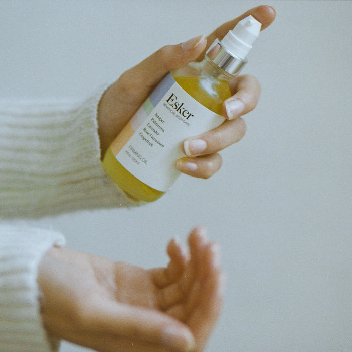 Lifestyle image of Esker Firming Oil variant: 2 fl oz
