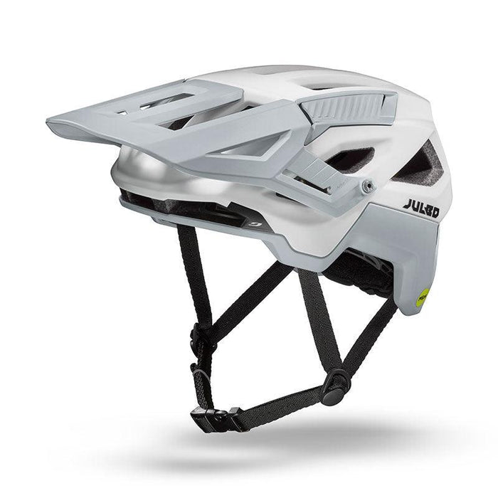 The Julbo USA Forest mountain bike helmet, shown from a side angle on a plain background, features white and gray colors, an adjustable visor, black chin straps, and an adjustable fit.