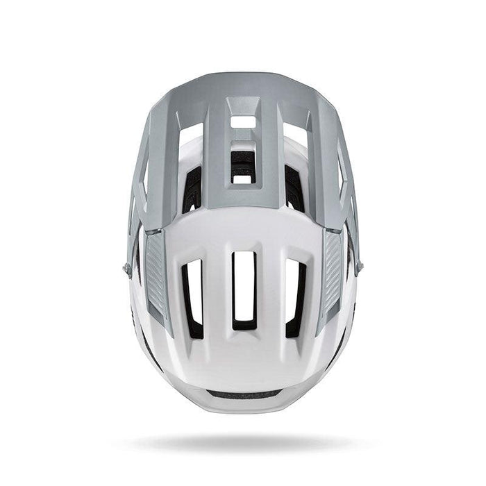 The Julbo USA Forest mountain bike helmet, shown from the front in white and gray, features multiple rectangular vents, a sleek design, and an adjustable fit for added comfort.
