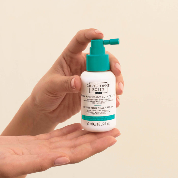 An arm swatch of Christophe Robin Fortifying Scalp Serum with Amaranth Peptides