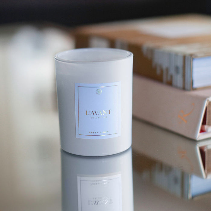 Lifestyle image of L’Avant Collective Fresh Linen Candle variant: White