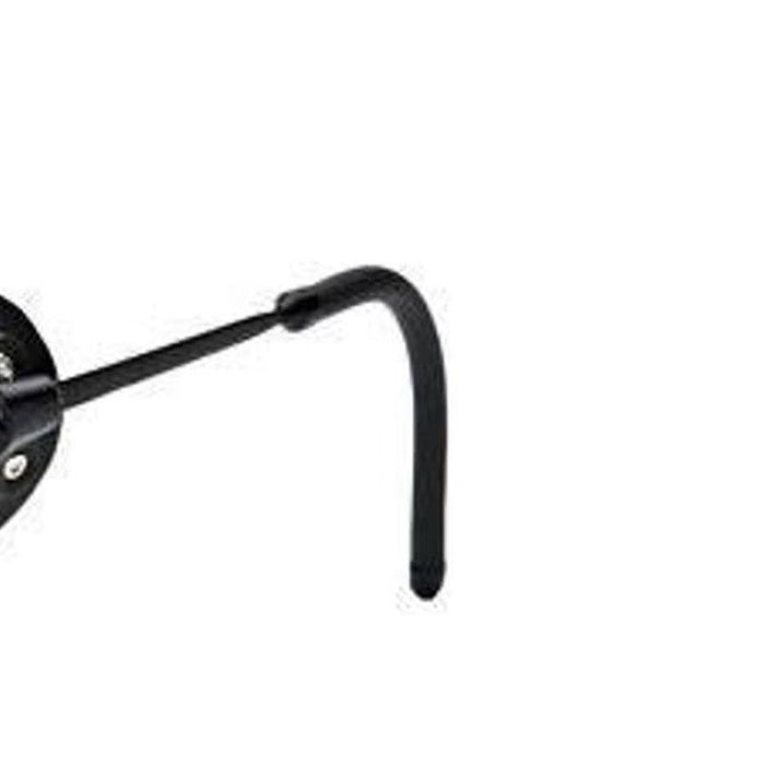 The Julbo USA Micropore Parts is a black metal wall hook with a curved end, ideal for organizing temple arms or side shields, and is shown mounted on a white wall. #color_micropore-temple-covers-pair-black-includes-end-stops