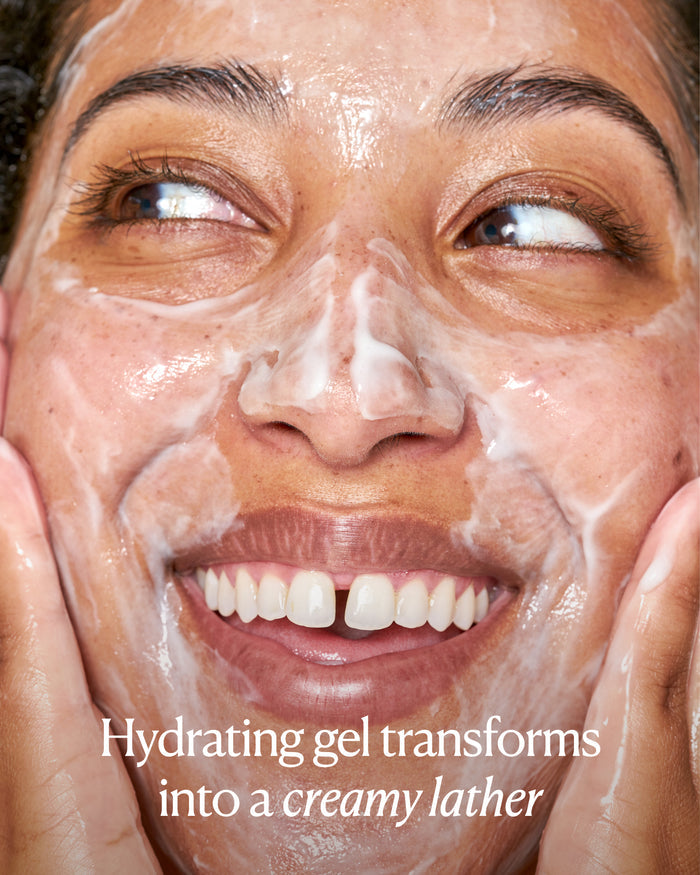 Hydrating gel cleanser transforming into a creamy lather during facial massage