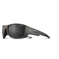 Julbo Eyewear’s Rookie 2 Kids sunglasses feature black polarized thick frames, dark lenses, and a small metallic logo on the arms. Engineered with Julbo sun technology for optimal protection, shown on a white background. #color_black-with-spectron-3-polarized-lens