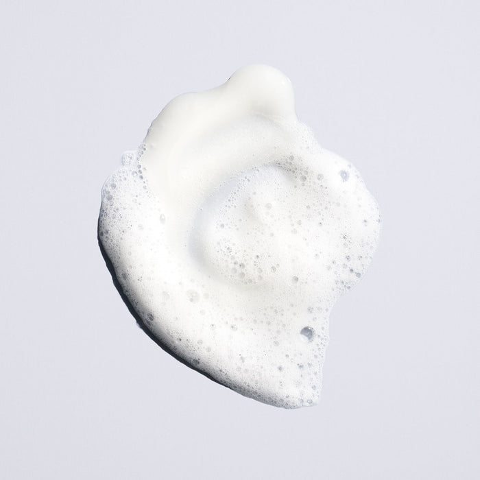 Lifestyle image of Oribe Run-Through Detangling Shampoo