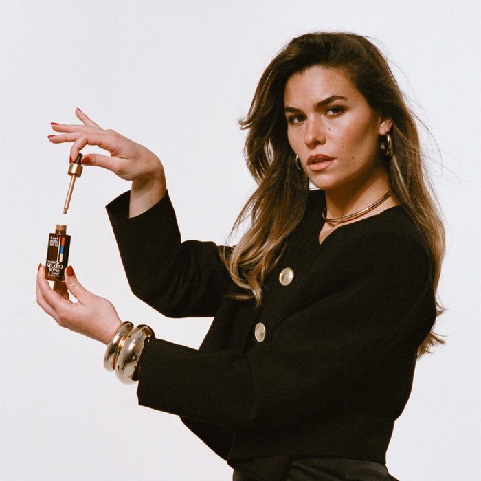 Model image of Vacation Studio Tone Bronzing Drops for Face SPF 50