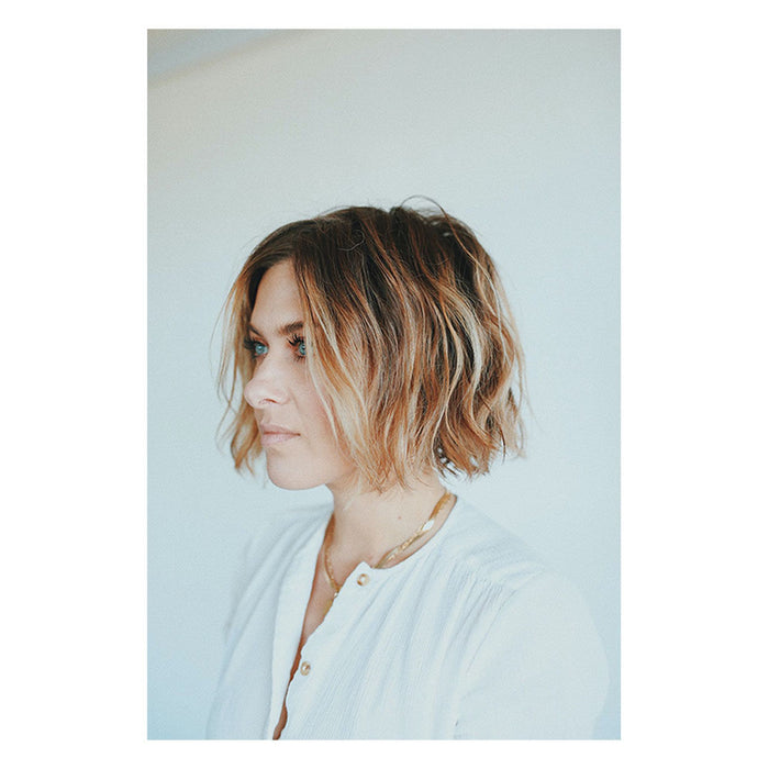 Image of an open R+Co Sun Catcher Power C Boosting Leave-in Conditioner