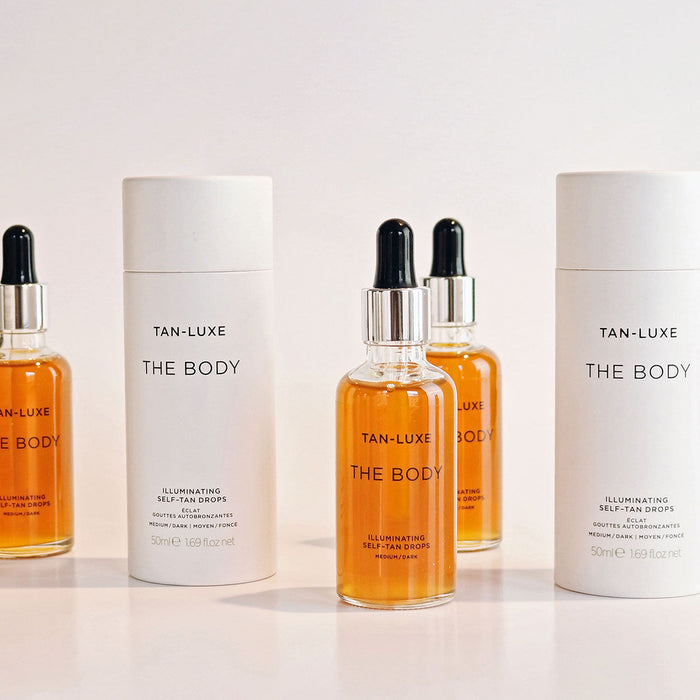 Lifestyle image of Tan-Luxe The Body Illuminating Self Tan Drops variant: Light/Medium - 1 oz