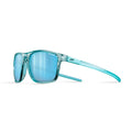 A pair of sport sunglasses with a translucent teal-blue frame and matching blue mirrored lenses, shown from a side profile on a white background. #color_translucent-blue-light-blue-with-spectron-3cf-lens