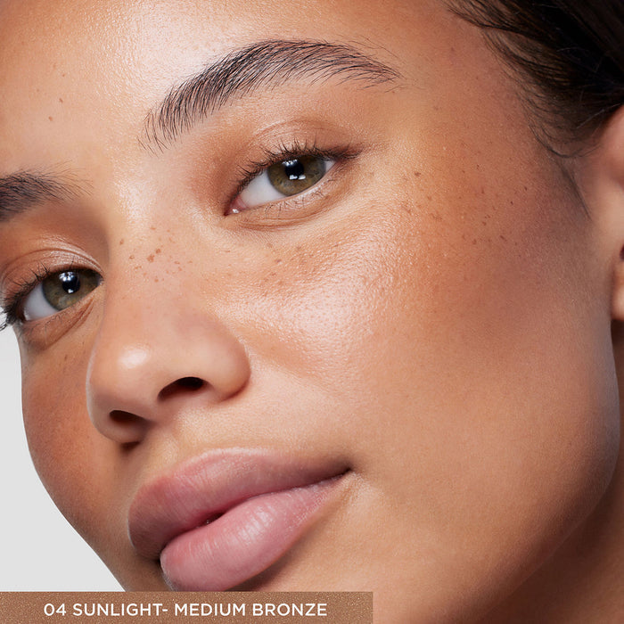 Model image of Laura Mercier Tinted Moisturizer Bronzer variant: 04 Sunlight