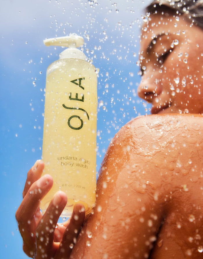 Undaria Algae Body Wash used in shower with water droplets highlighting fresh, clean skin