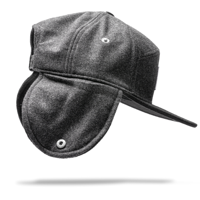 Stay warm in cold weather with the gray Julbo Eyewear Woodsman Hat, featuring a brim and cozy ear flaps. Inspired by classic designs, it's shown here against a white background with a subtle shadow underneath. #color_julbo-woodsman-hat-charcoal